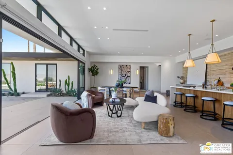 a bed room with large bed and a large window