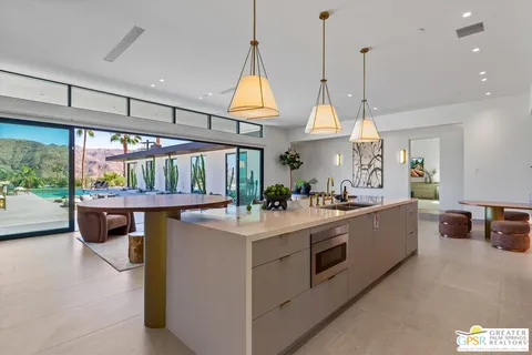 a bedroom with bed and glass door