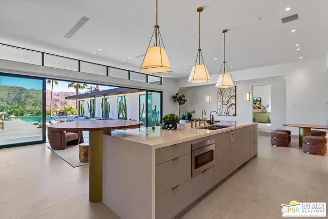 a bedroom with bed and glass door