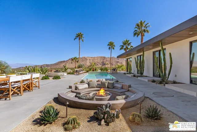 a bedroom with a bed and a lamp