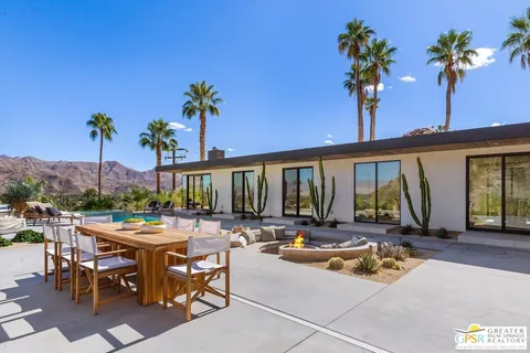 a en suite bathroom with a tub shower and window