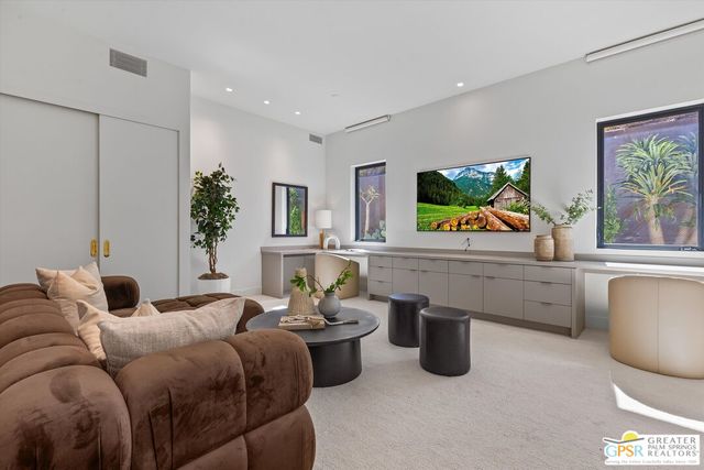 a bedroom with a bed and a lamp