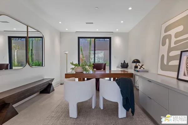 a view of a livingroom with workspace and a couch