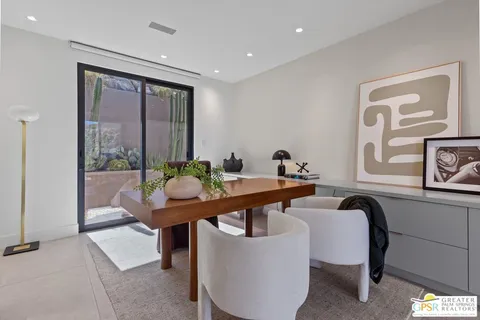 a view of a livingroom with workspace and a couch