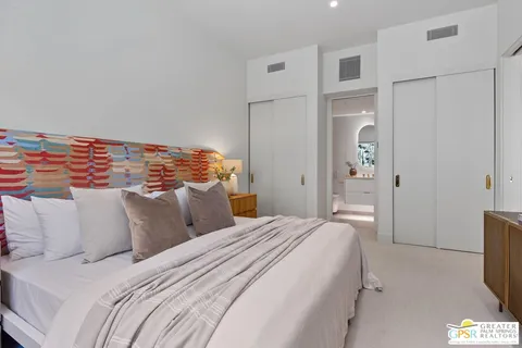 a view of a house with swimming pool and sitting area