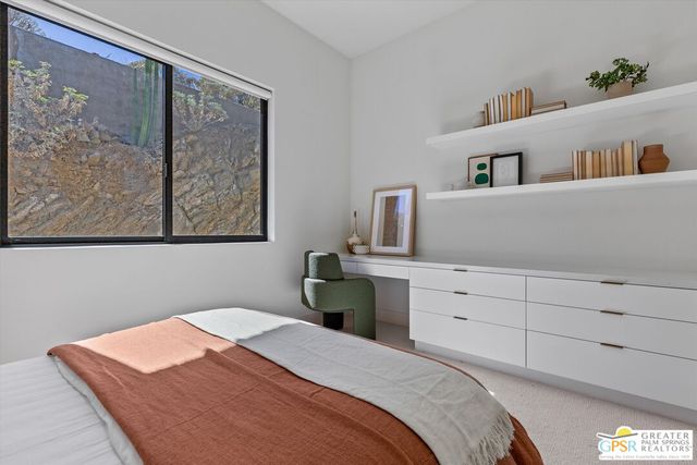a kitchen with a sink and a stove top oven