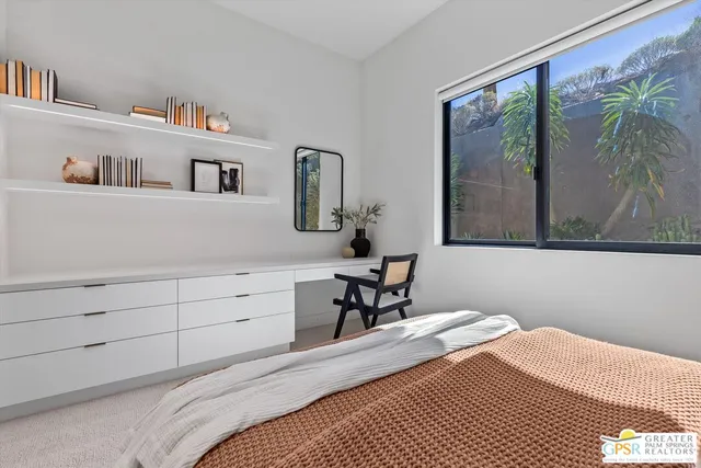 a swimming pool with outdoor seating