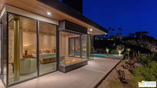 a living room with stainless steel appliances kitchen island granite countertop furniture and a view of kitchen