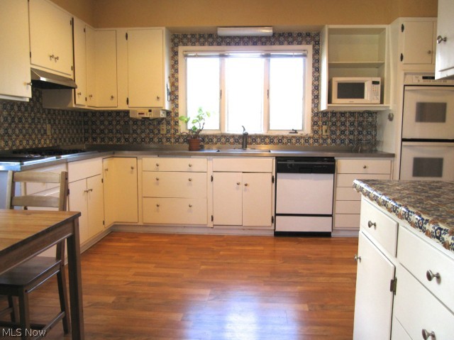 2939 Huntington Road Cleveland, OH 44120 - Photo 6 of 21 Fantastic country kitchen with beautiful period tile on backsplash and tile accented counter tops. This kitchen is spacious enough to fit a large table in the eating area as well as accommodate a large group while cooking!