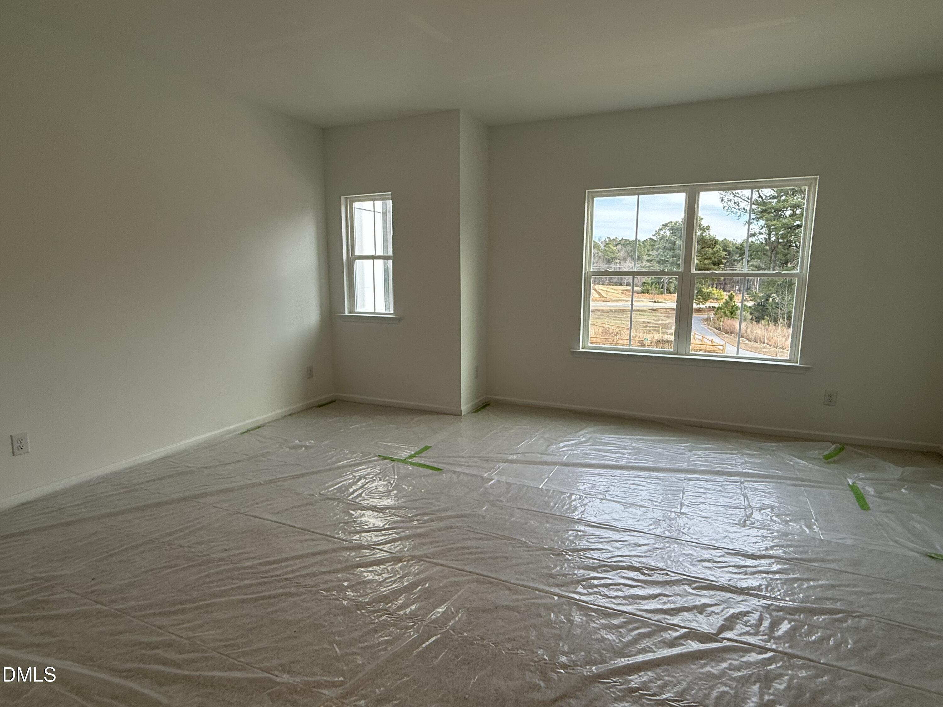 508 Contempo Court, Unit 39 Rolesville, NC 27571 - Photo 11 of 37 a view of an empty room with a window