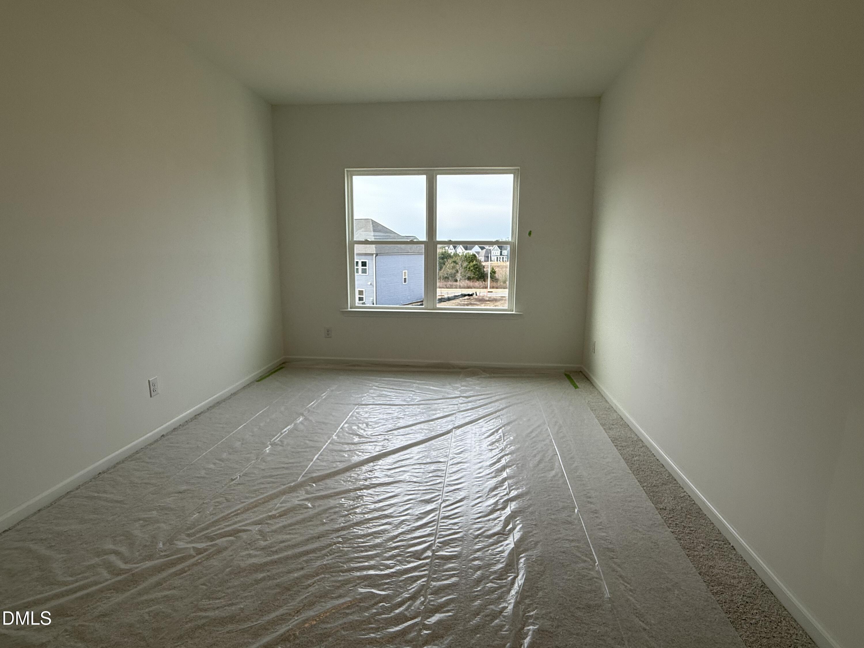 508 Contempo Court, Unit 39 Rolesville, NC 27571 - Photo 16 of 37 an empty room with wooden floor and windows