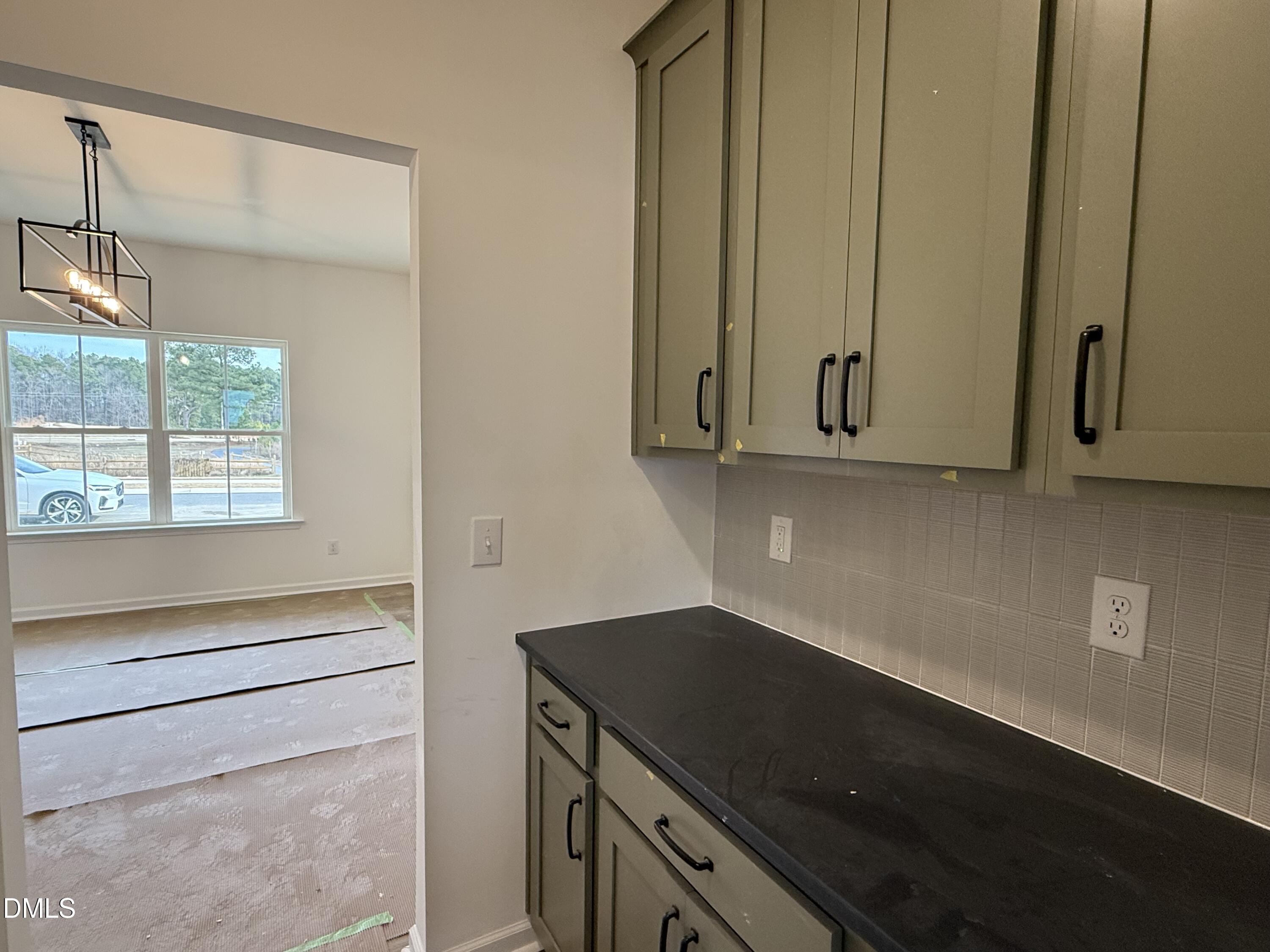 508 Contempo Court, Unit 39 Rolesville, NC 27571 - Photo 3 of 37 a view of cabinets and window