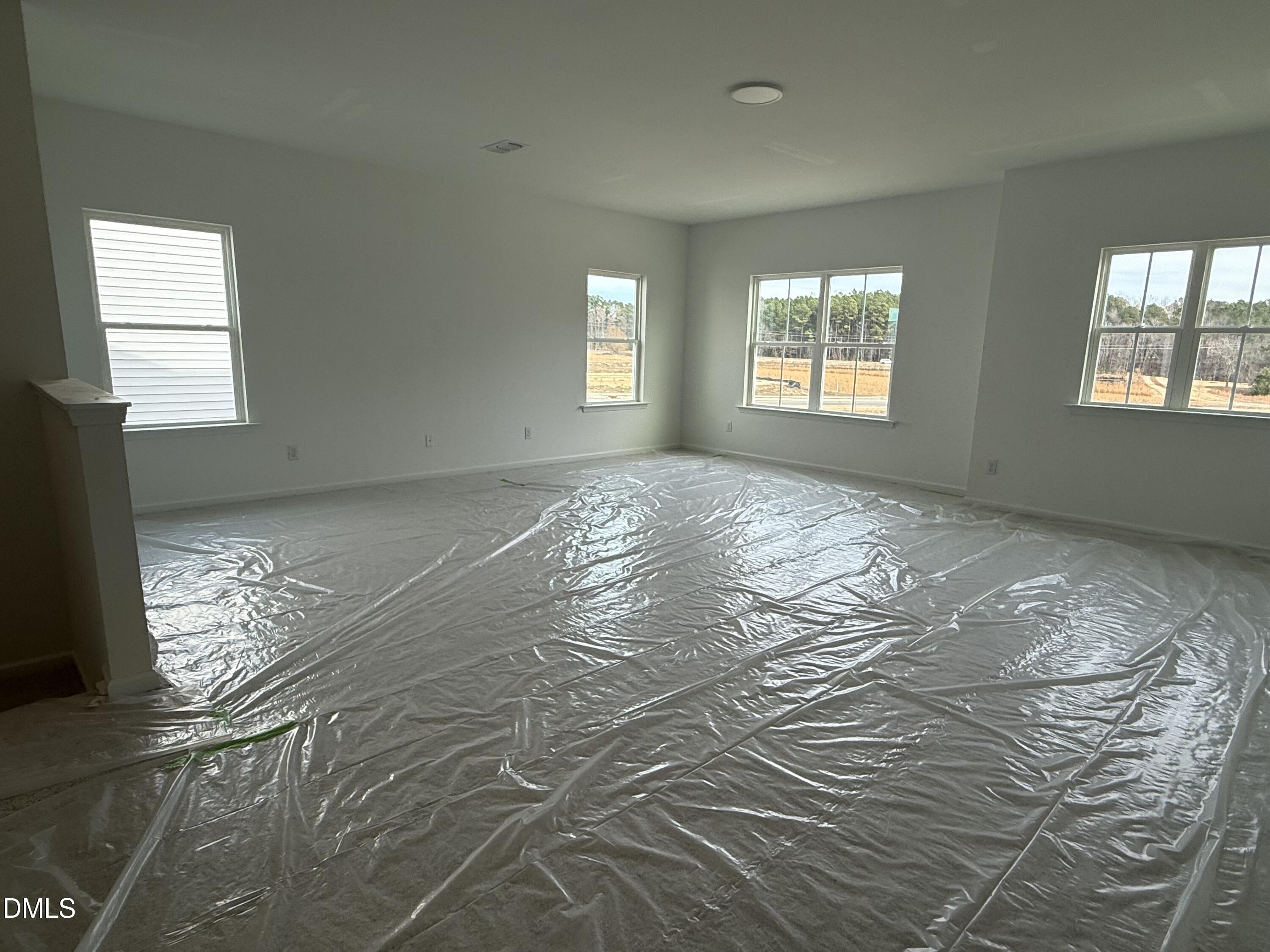 508 Contempo Court, Unit 39 Rolesville, NC 27571 - Photo 10 of 37 a view of empty room with windows