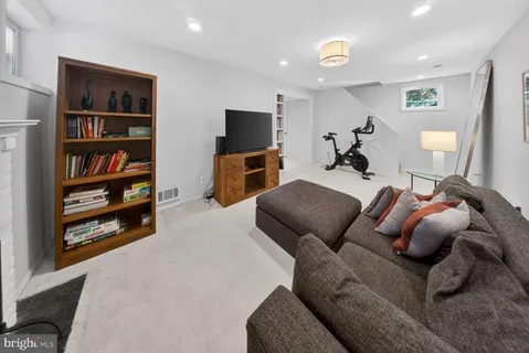 a bedroom with furniture and a flat screen tv