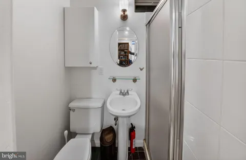 a bathroom with a toilet and a sink