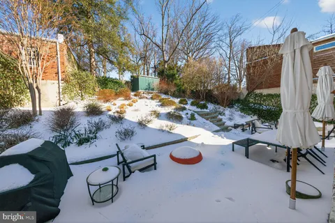 a view of backyard with swimming pool