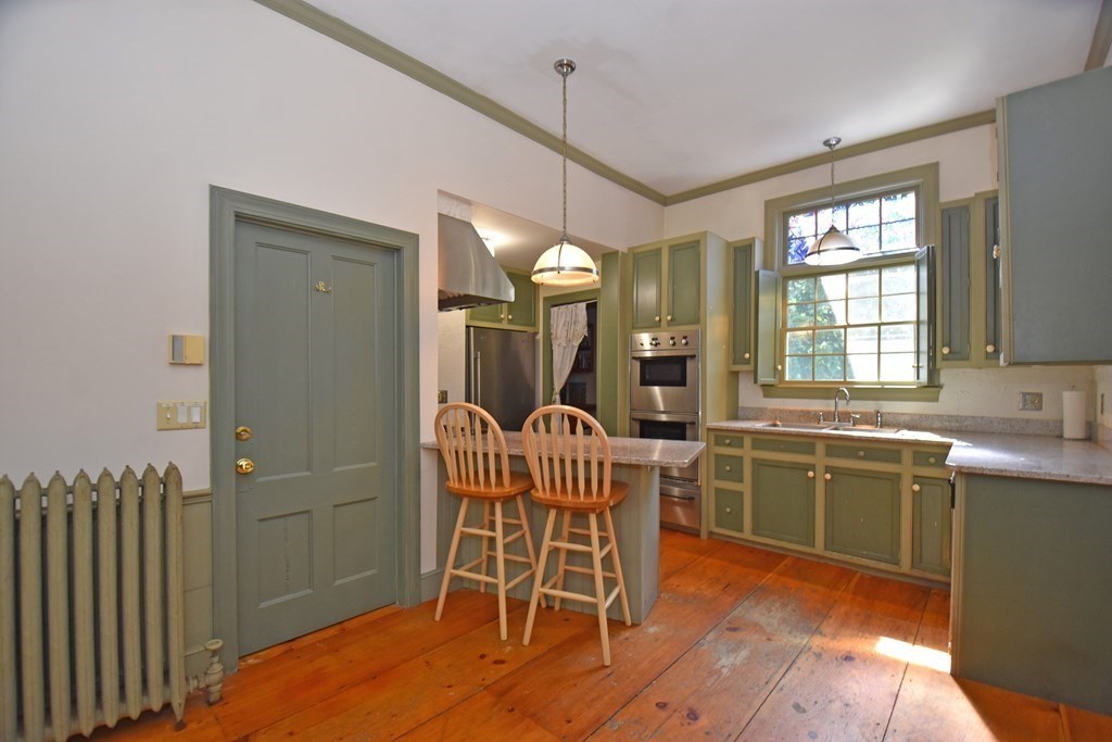 52 Central Street Gardner, MA 01440 - Photo 12 of 38 a view of a dining room with furniture window and wooden floor