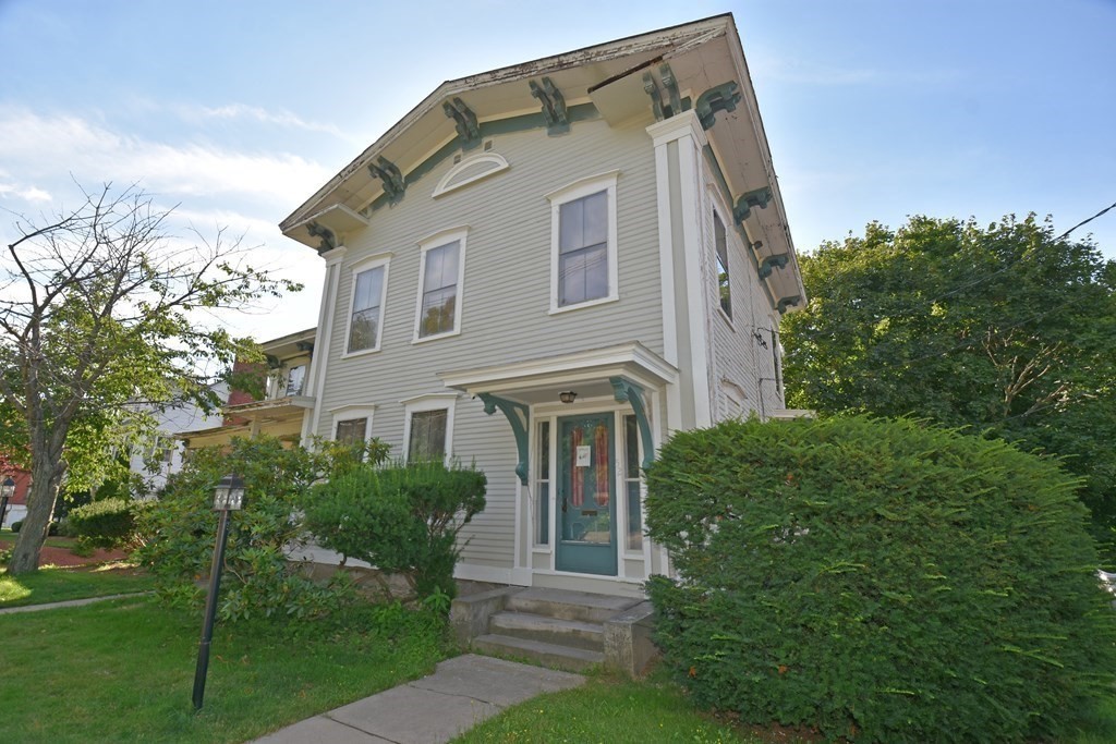 52 Central Street Gardner, MA 01440 - Photo 2 of 38 a front view of a house with garden