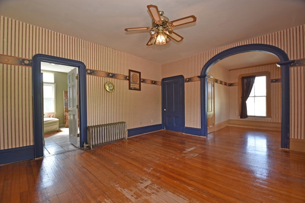 52 Central Street Gardner, MA 01440 - Photo 21 of 38 a view of livingroom with hardwood floor and hallway
