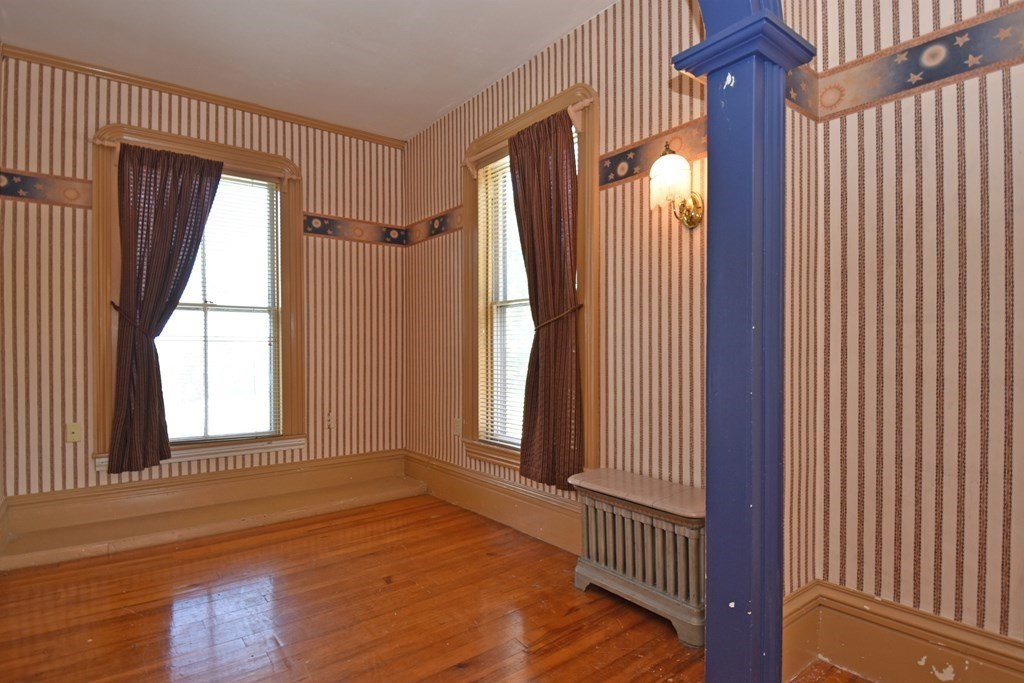 52 Central Street Gardner, MA 01440 - Photo 22 of 38 a view of a room with wooden floor and windows