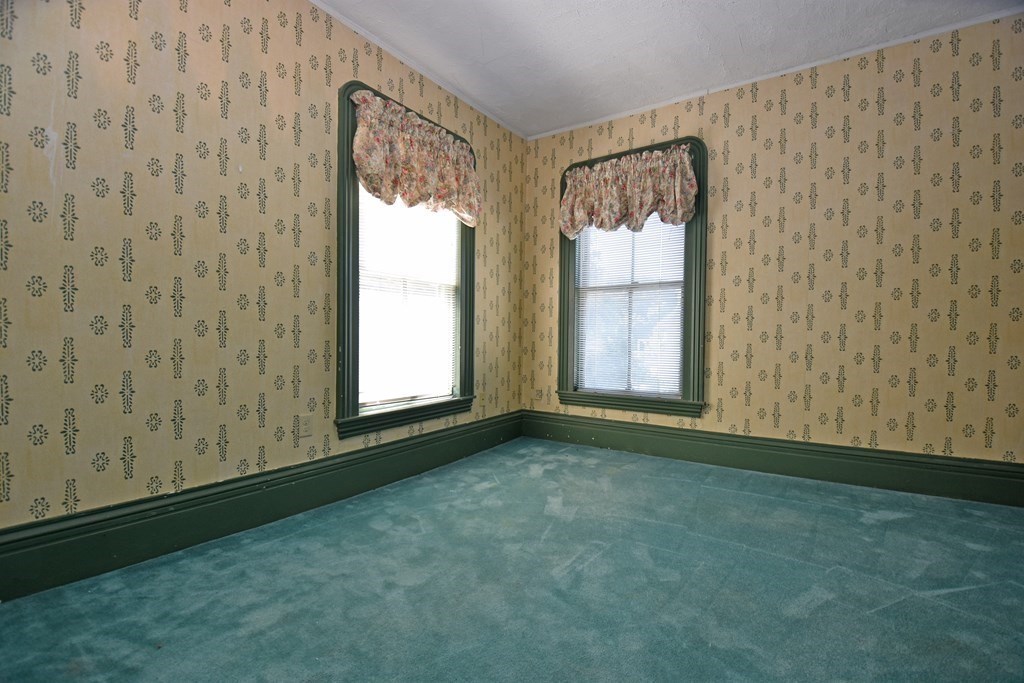 52 Central Street Gardner, MA 01440 - Photo 25 of 38 a view of an empty room with a window and dresser