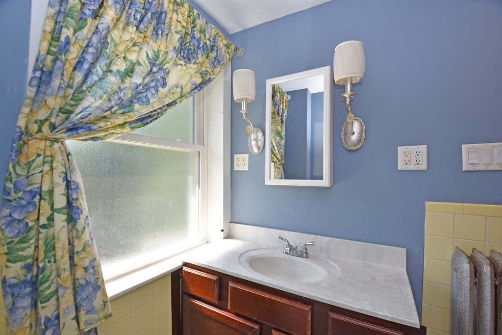 52 Central Street Gardner, MA 01440 - Photo 27 of 38 a bathroom with a sink and a mirror