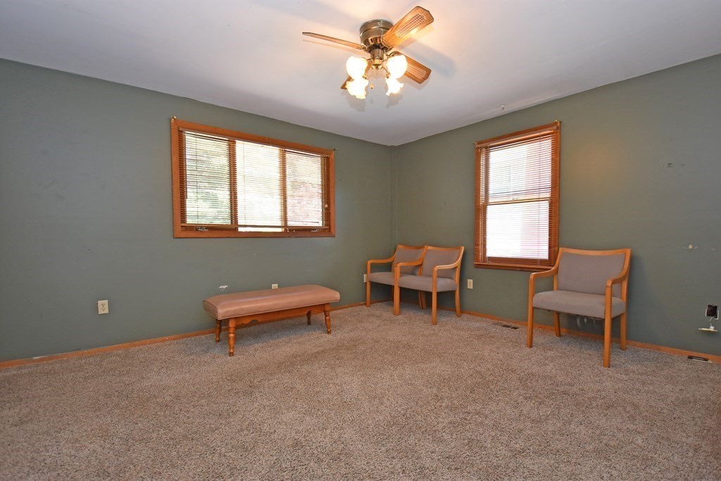 52 Central Street Gardner, MA 01440 - Photo 30 of 38 a living room with furniture a window and a chandelier