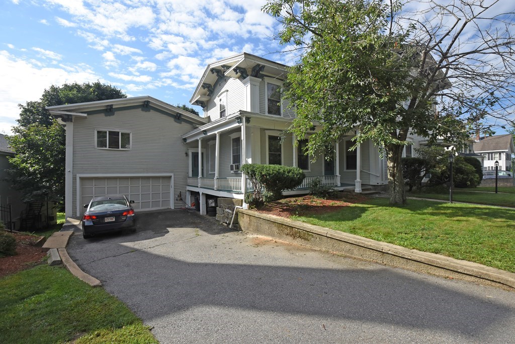 52 Central Street Gardner, MA 01440 - Photo 3 of 38 a view of a house with a garden