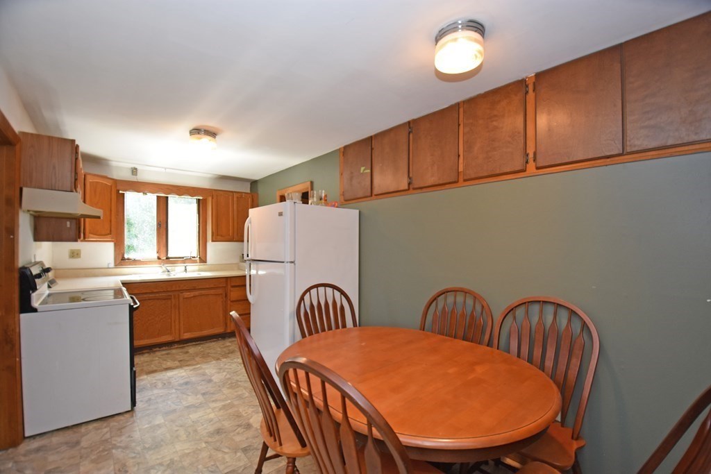52 Central Street Gardner, MA 01440 - Photo 31 of 38 a dining room with furniture and wooden floor