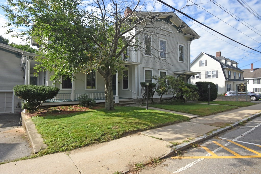 52 Central Street Gardner, MA 01440 - Photo 38 of 38 a view of a white house with a yard and large tree
