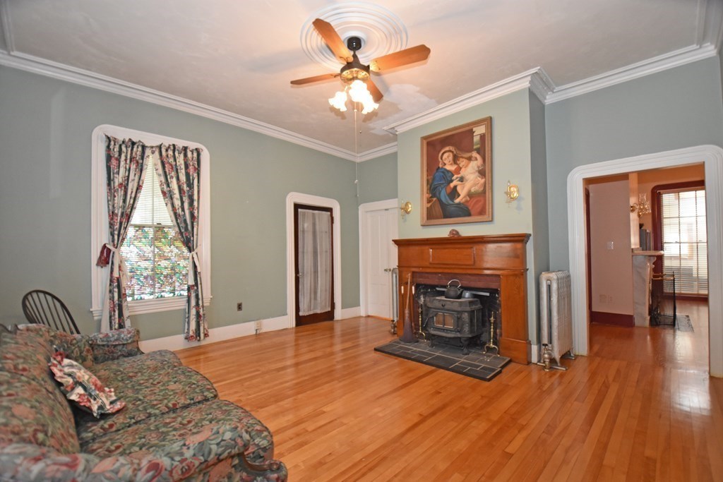 52 Central Street Gardner, MA 01440 - Photo 5 of 38 a bedroom with a bed and a fireplace