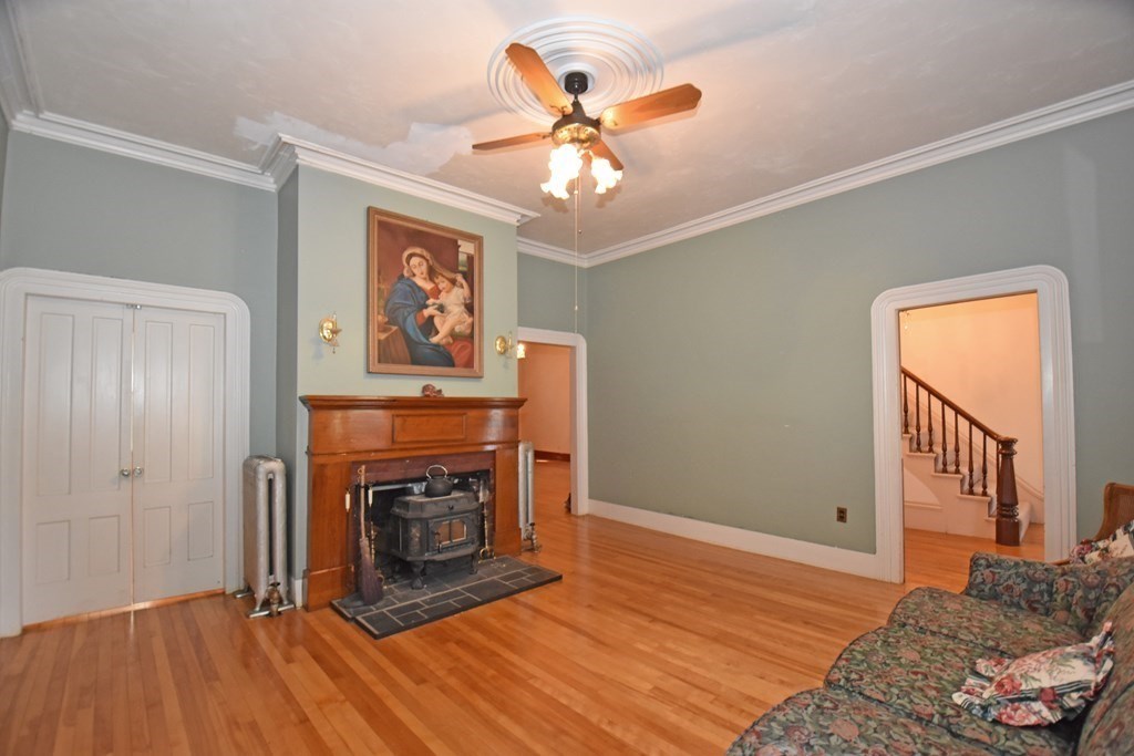 52 Central Street Gardner, MA 01440 - Photo 7 of 38 a living room with furniture and a fireplace