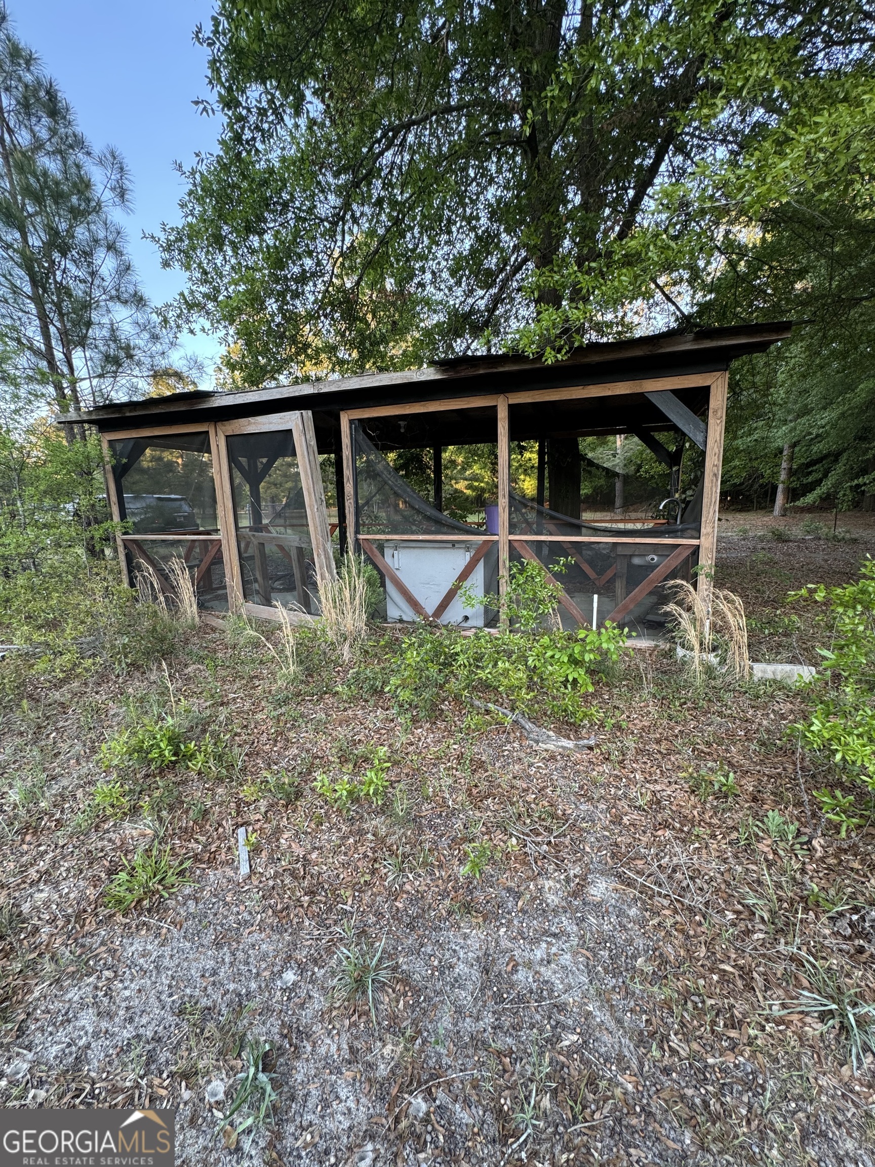 1045 Horseshoe Road Augusta, GA 30906 - Photo 2 of 16 a backyard of a house with lots of green space