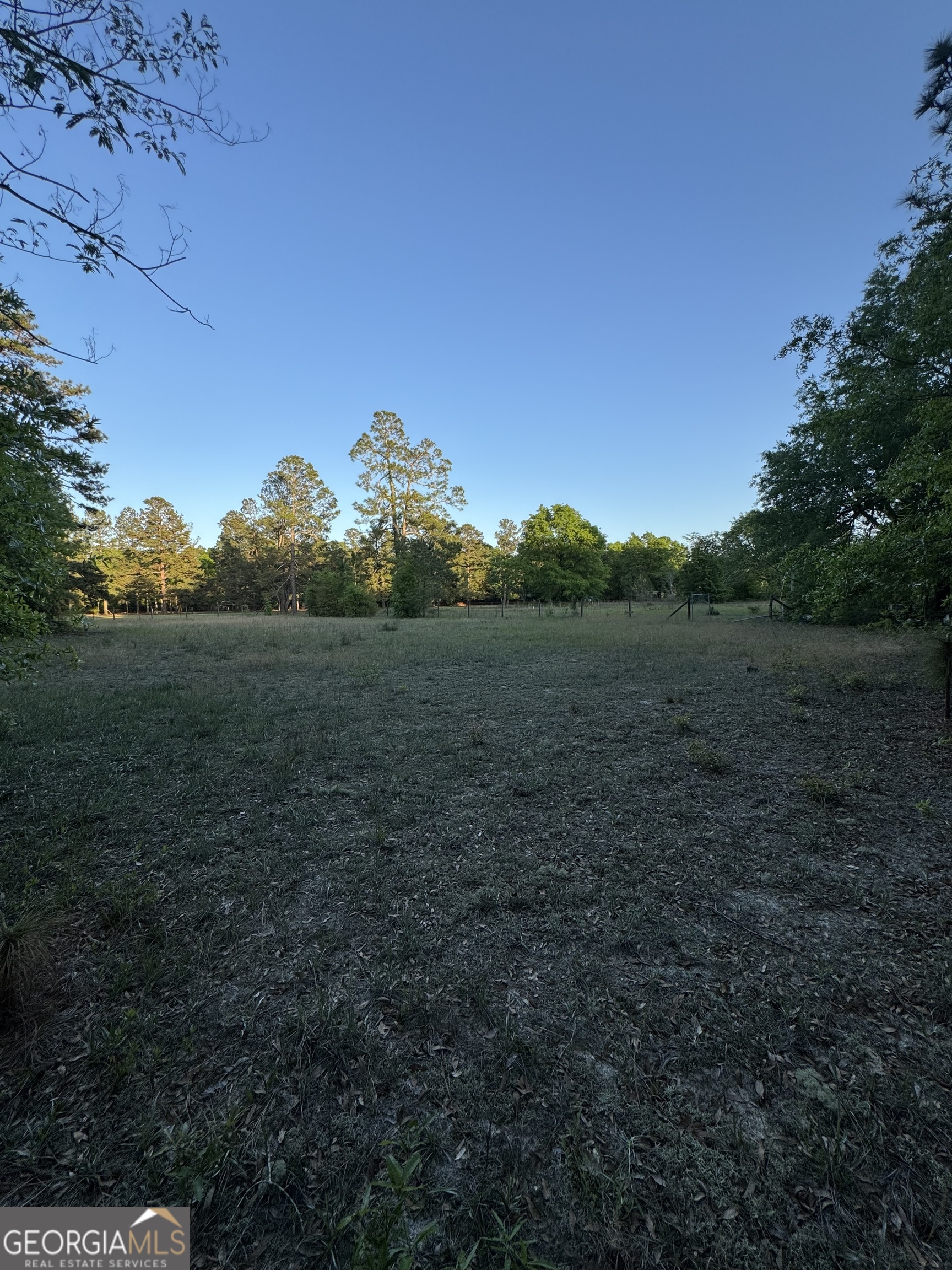 1045 Horseshoe Road Augusta, GA 30906 - Photo 7 of 16 a view of a field with an trees