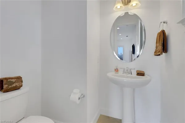 a bathroom with a sink and mirror