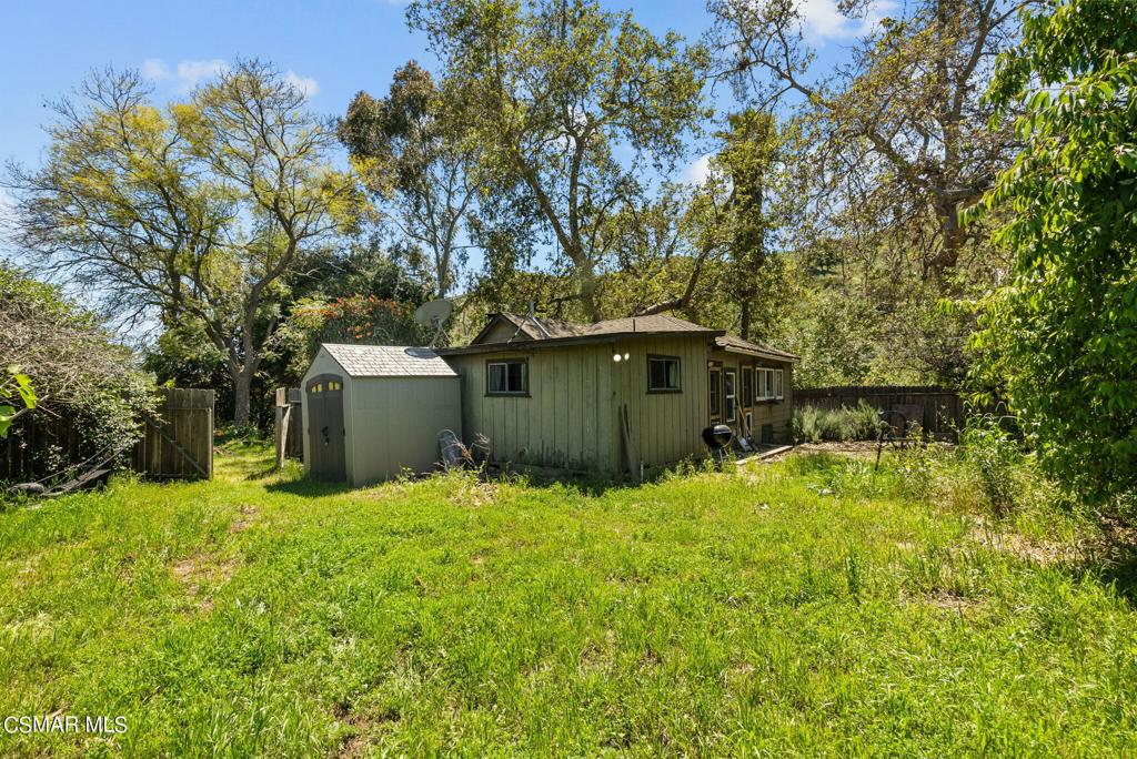 5682 Pine Grove Road Santa Paula, CA 93060 - Photo 16 of 53 a backyard of a house with yard and tree