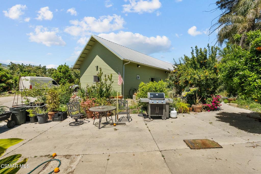5682 Pine Grove Road Santa Paula, CA 93060 - Photo 27 of 53 a view of a patio with table and chairs and potted plants