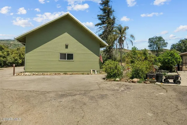 a view of a house with a yard and garage