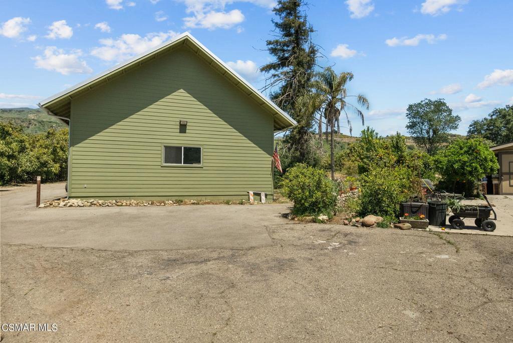 5682 Pine Grove Road Santa Paula, CA 93060 - Photo 28 of 53 a view of a house with a yard and garage