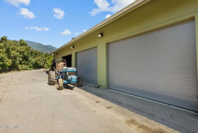 a view of a patio with table and chairs and couches