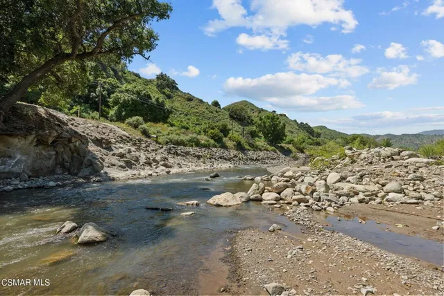 a view of a lake with beach