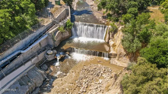 a view of balcony with wooden fence