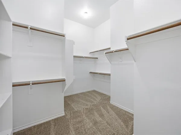 a view of an empty walk in closet