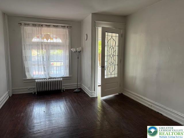 208 Ridge Avenue Allentown, PA 18102 - Photo 4 of 17 an empty room with wooden floor and windows