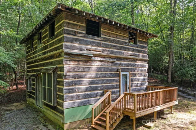 a view of outdoor space with deck and plants