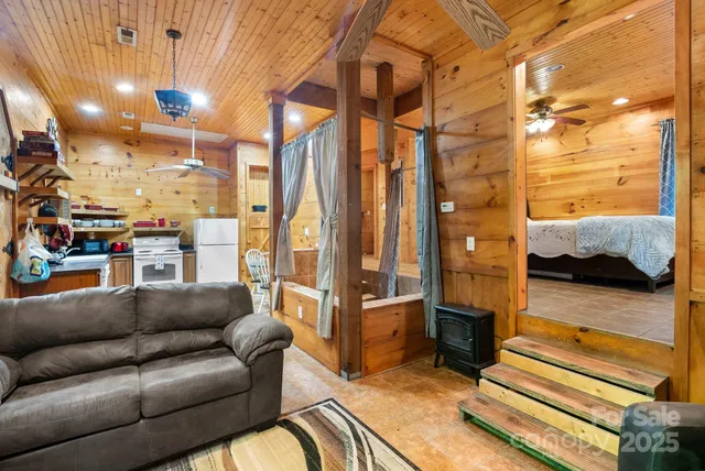 a kitchen with refrigerator and cabinets