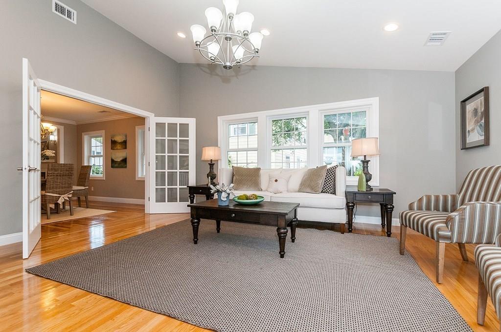 22 Sharpe Road Belmont, MA 02478 - Photo 7 of 38 a living room with furniture and a chandelier