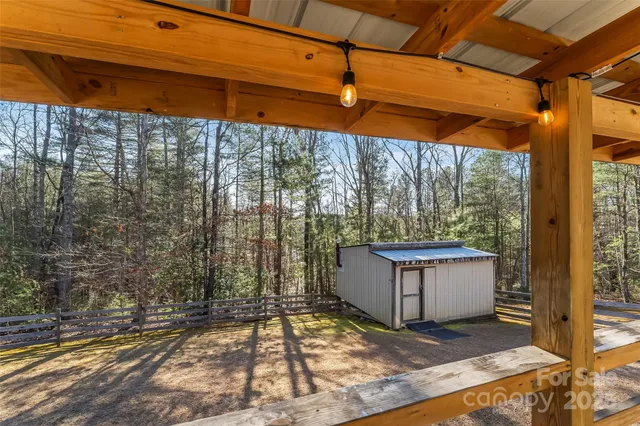 a view of a backyard with a small cabin