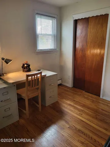 a room that has a bed and a table in it