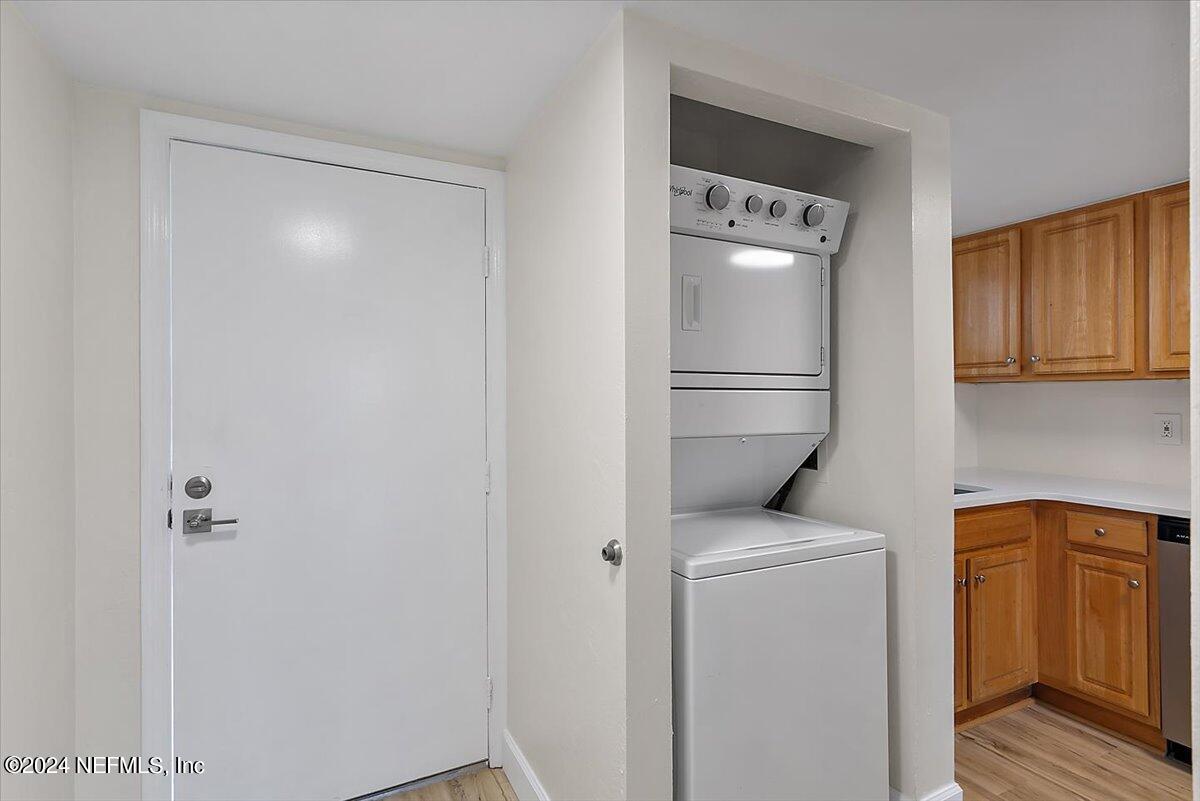 3100 Ocean Shore Boulevard, Unit 106 Ormond Beach, FL 32176 - Photo 13 of 21 a utility room with dryer and washer